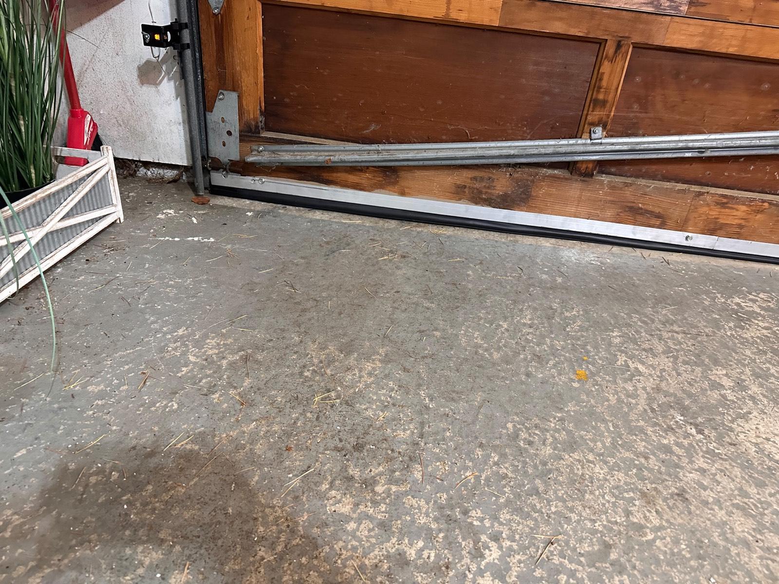 Garage door pulled off its track, awaiting emergency repair